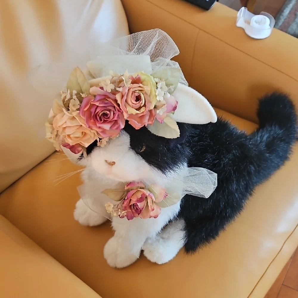 Black and White Plush Cat with flowered hat.